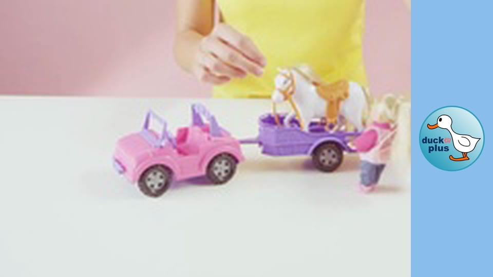 The World of Toys - Girl driving a car